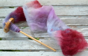 Felted fiber fluffed and being spun