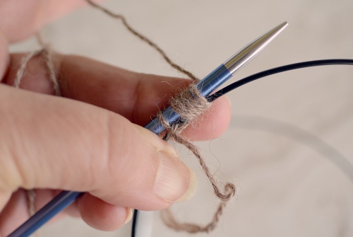 Slide half the stitches to the circular needle cord.
